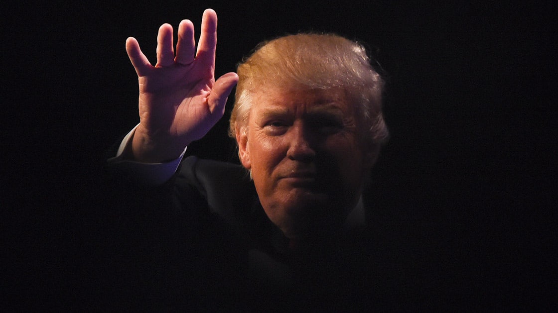 Republican presidential hopeful Donald Trump waves at a rally at the Westgate Hotel and Resort in Las Vegas, Nevada on December 14, 2015. Trump will face off with Texas Sen. Ted Cruz, retired neurosurgeon Ben Carson and six other main stage candidates at the GOP debate on December 15. AFP PHOTO / ROBYN BECK / AFP / ROBYN BECK (Photo credit should read ROBYN BECK/AFP/Getty Images)