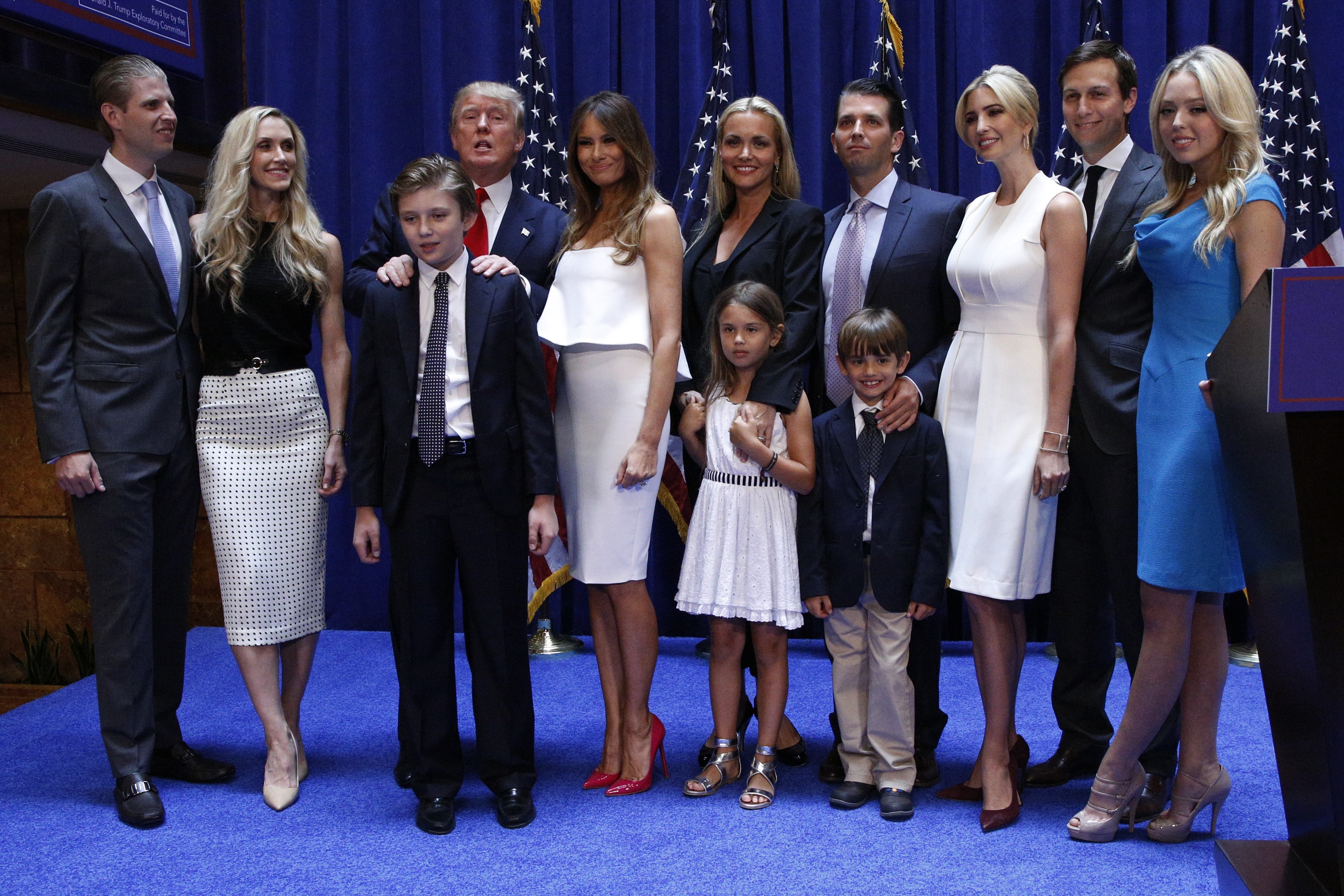 U.S. Republican presidential candidate, real estate mogul and TV personality Donald Trump poses with his family after formally announcing his campaign for the 2016 Republican presidential nomination during an event at Trump Tower in New York June 16, 2015. The Trump family from L; Eric Trump and his wife Lara, Donald Trump, son Barron, Melania Trump, Vanessa Haydon and her husband Donald Trump Jr., children Kia Trump and Donald Trump III, Ivanka Trump and her husband Jared Kushner and Tiffany Trump. REUTERS/Brendan McDermid - RTX1GS77