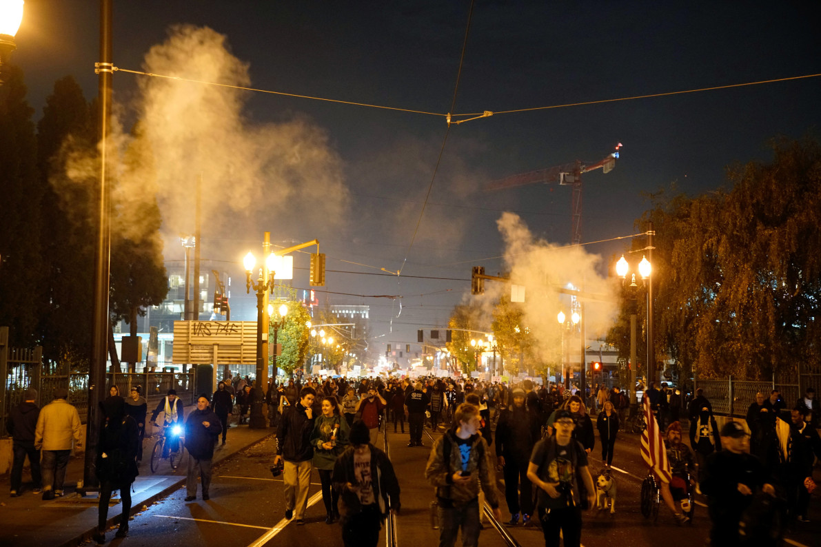 Smoke rises during a protest against the election of Republican Donald Trump as President of the United States in Portland, Oregon, U.S. November 10, 2016. REUTERS/William Gagan FOR EDITORIAL USE ONLY. NO RESALES. NO ARCHIVES - RTX2T63J